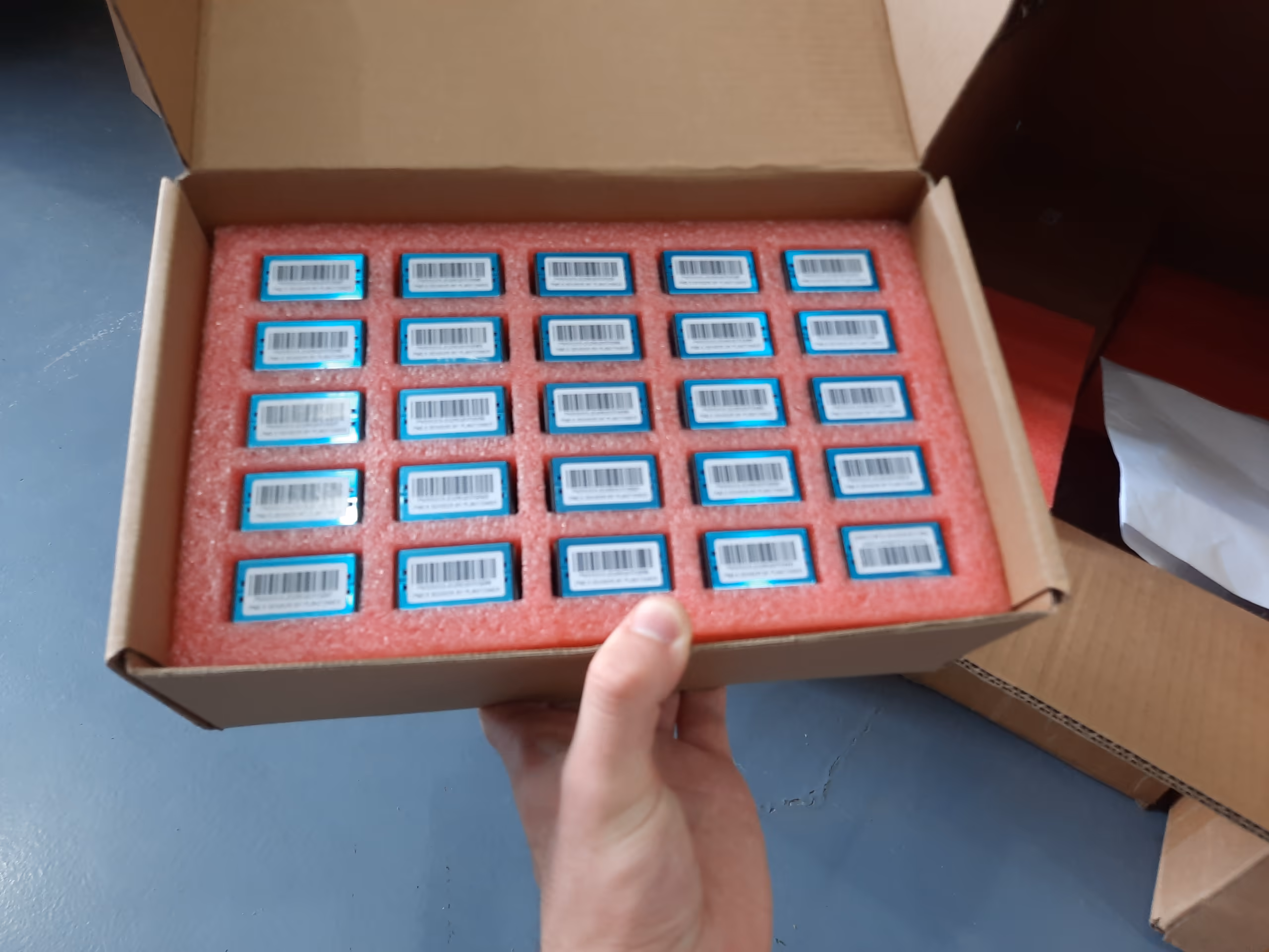 Tray of small components laid out during the production run